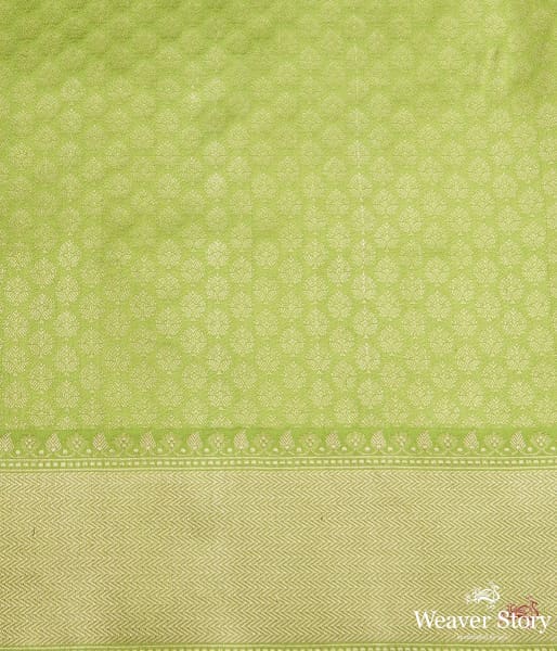 Neon Green kadhwa booti saree with zari border and a blue selvedge