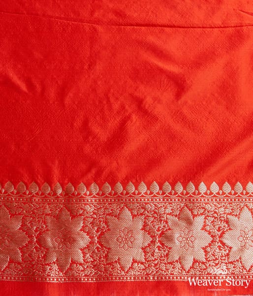 Handwoven Banarasi saree in red with broad floral border