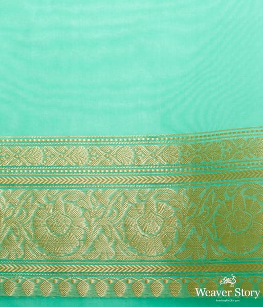 Green banarasi kora saree with beldar border and kairi boota