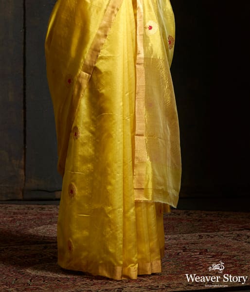 Lime green chanderi silk saree with floral bootis in gold zari with meenakari.
