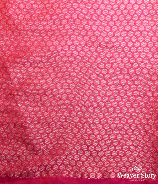 Handwoven pink katan silk saree with floral motifs and zari border