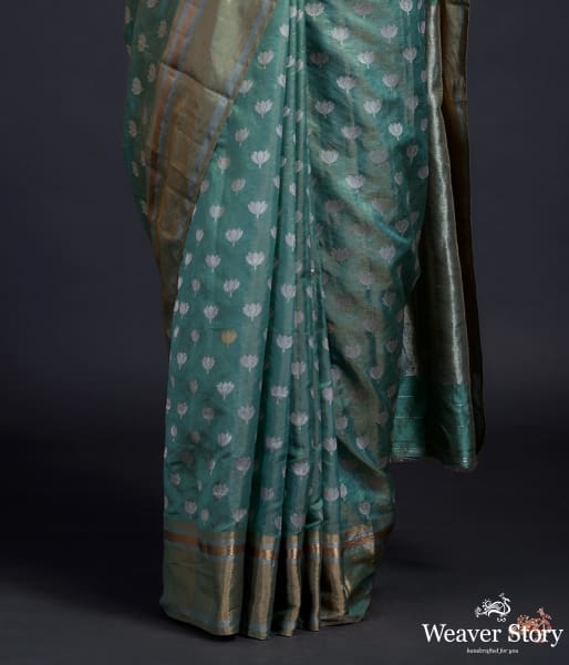 Green chanderi silk saree with floral motifs and a tissue weft