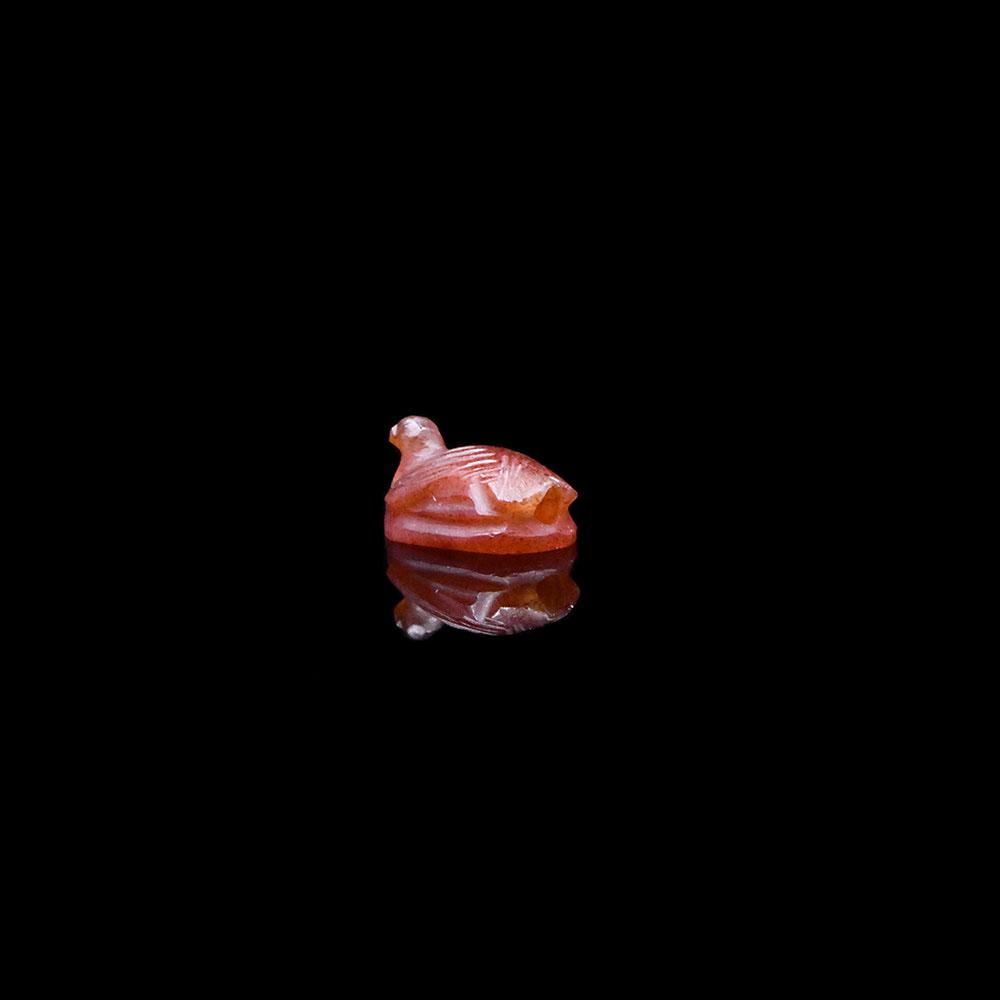 An Egyptian Carnelian Amulet of a Bird, New Kingdom, ca. 1550 - 1295 BCE
