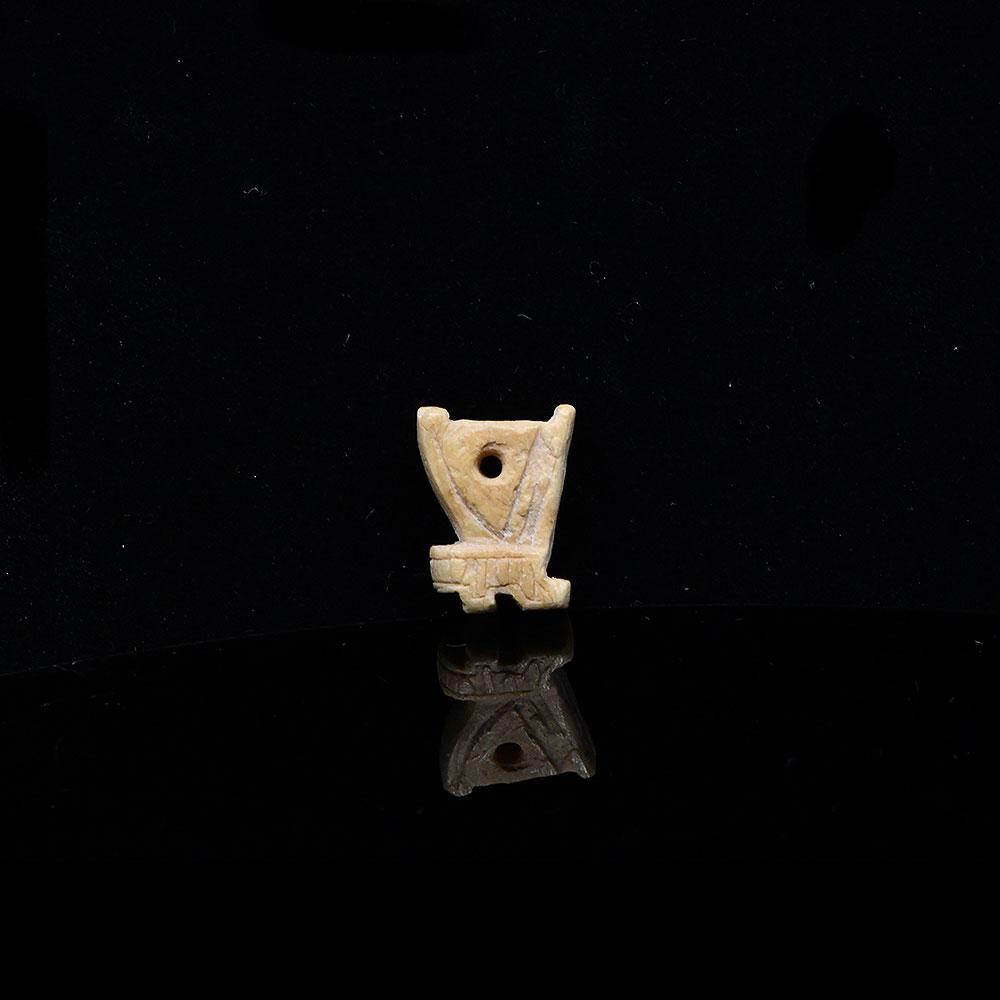 An Egyptian Bone 'Red Crown' Amulet, Late Period, ca. 664 - 332 BCE