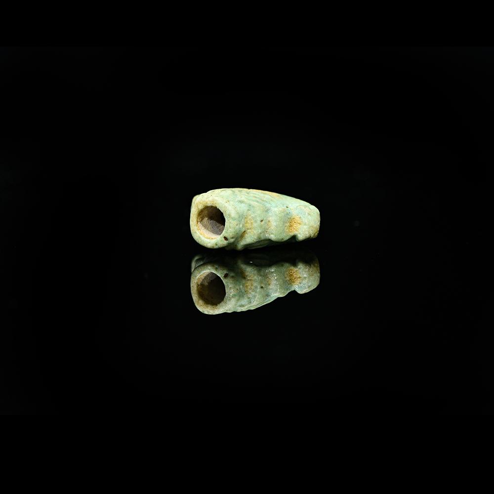 An Egyptian Faience Lotus Terminal, Late Period, ca. 664 - 332 BCE