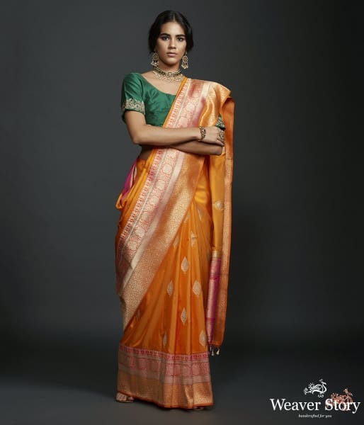 Mango yellow dual tone kadhiyal border saree with a kadhwa booti and pink selvedge