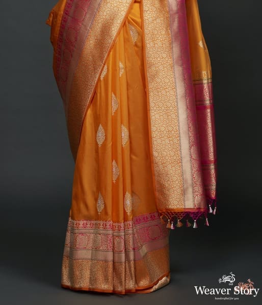 Mango yellow dual tone kadhiyal border saree with a kadhwa booti and pink selvedge