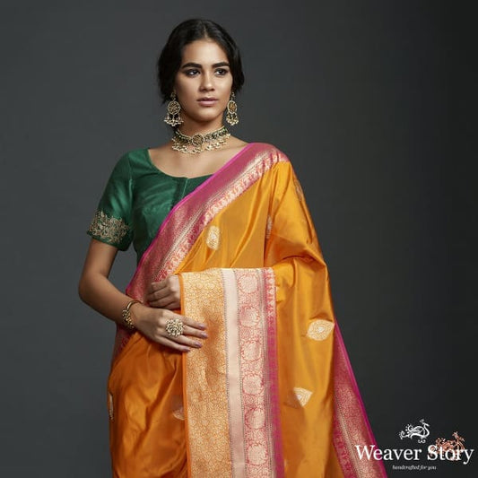 Mango yellow dual tone kadhiyal border saree with a kadhwa booti and pink selvedge