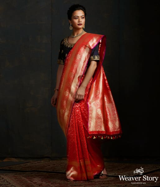 Handwoven Banarasi saree in red with broad floral border