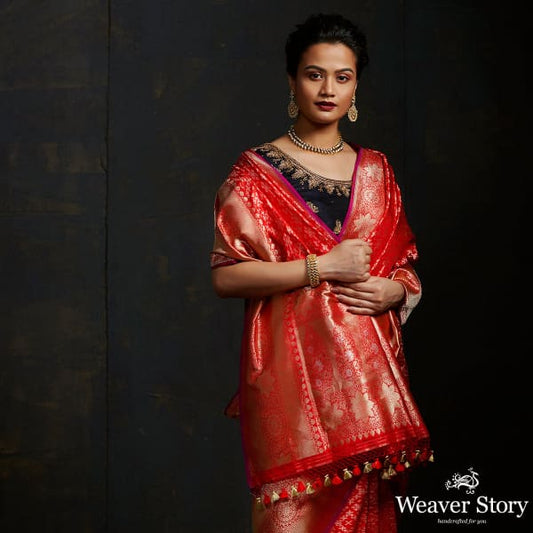 Handwoven Banarasi saree in red with broad floral border