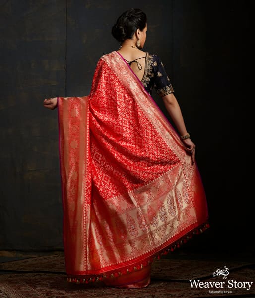 Handwoven Banarasi saree in red with broad floral border