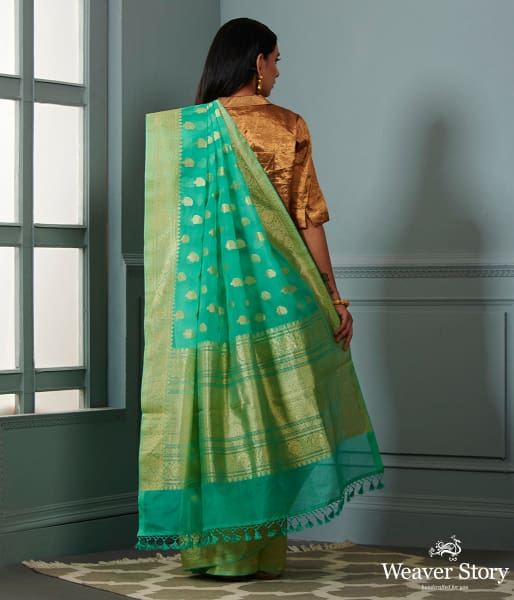Green banarasi kora saree with beldar border and kairi boota