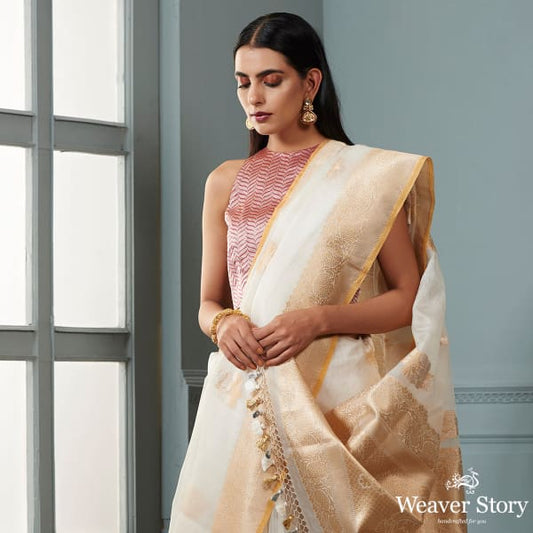 Ivory and gold banarasi kora saree with beldar border and kadhwa booti