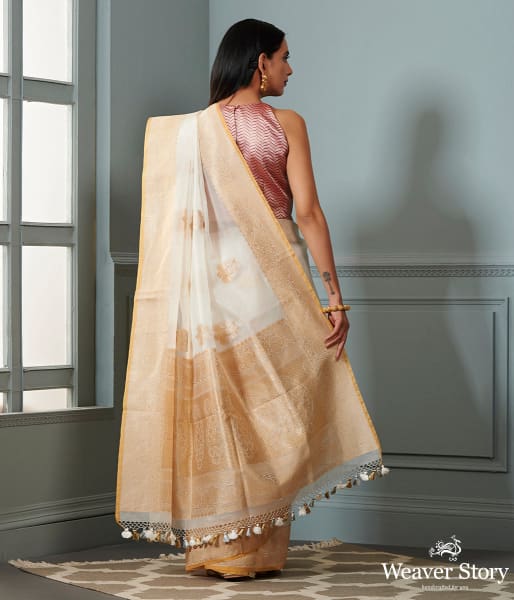 Ivory and gold banarasi kora saree with beldar border and kadhwa booti