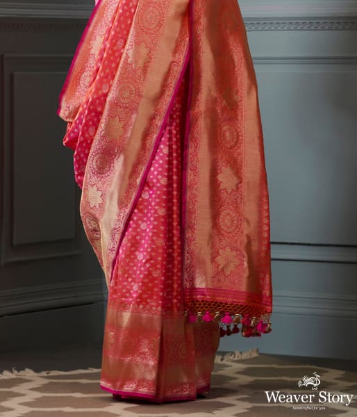 Handwoven Banarasi saree in Pink and peach dual tone with broad floral border