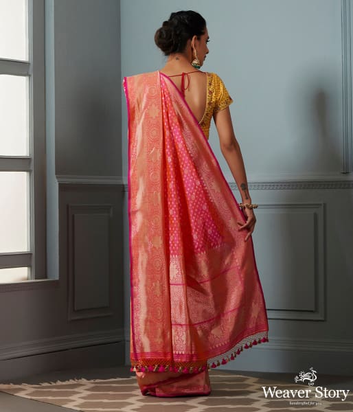 Handwoven Banarasi saree in Pink and peach dual tone with broad floral border