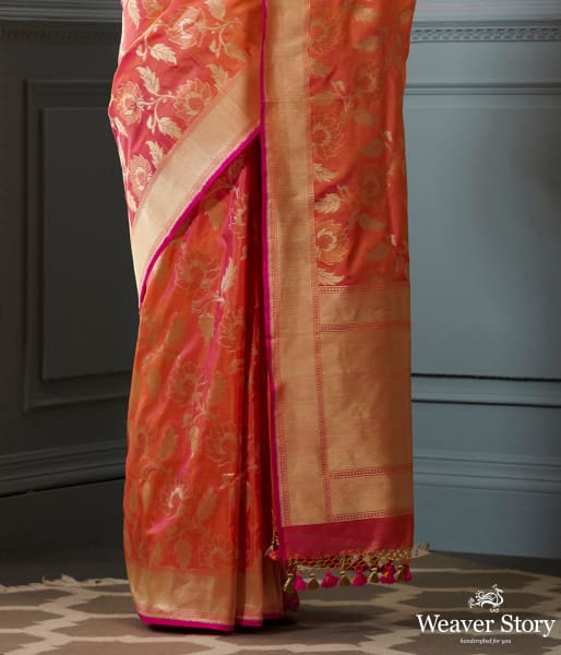 Handwoven Banarasi saree in Oramge and peach dual tone with floral jaal