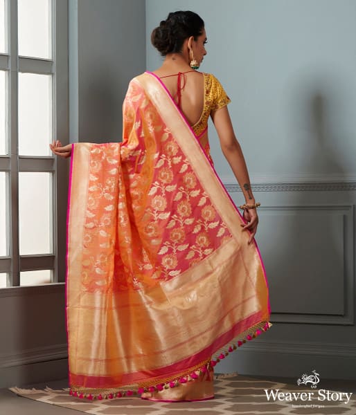 Handwoven Banarasi saree in Oramge and peach dual tone with floral jaal