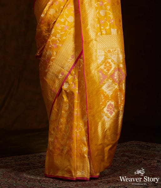 Handwoven Banarasi katan silk saree in mustard yellow with meenakari jaal