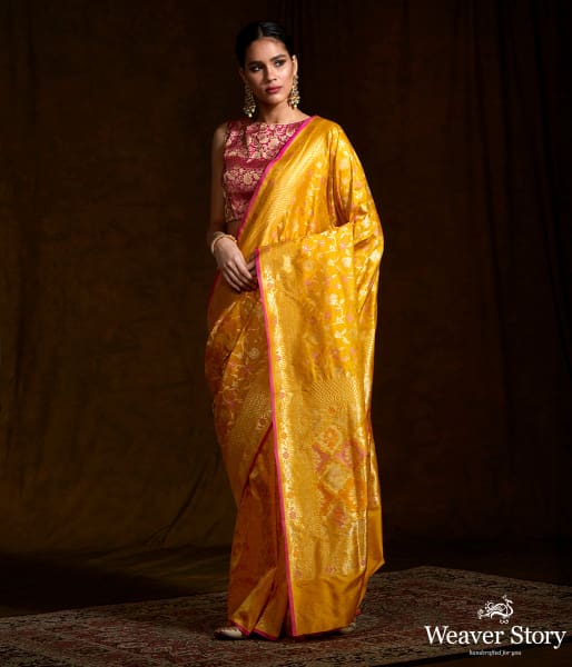 Handwoven Banarasi katan silk saree in mustard yellow with meenakari jaal