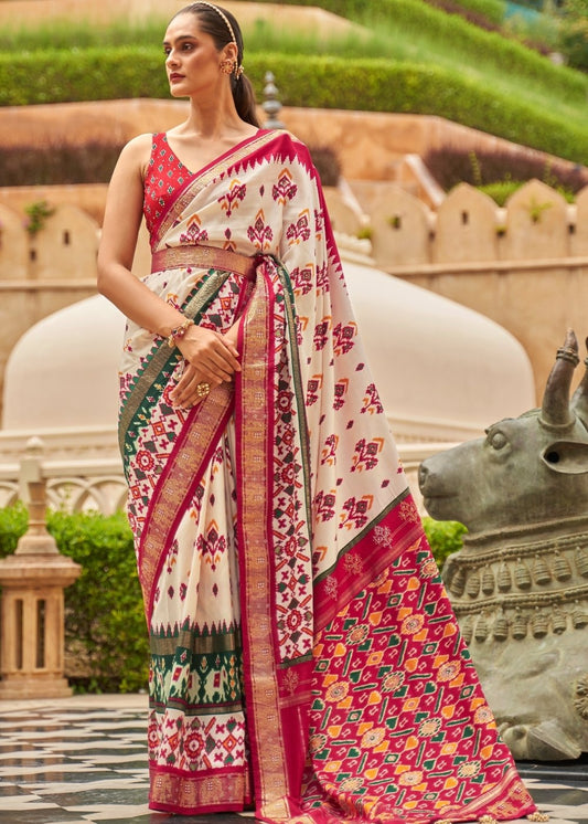 White & Red Patola Silk Saree with Zari Border & Tassels On Pallu