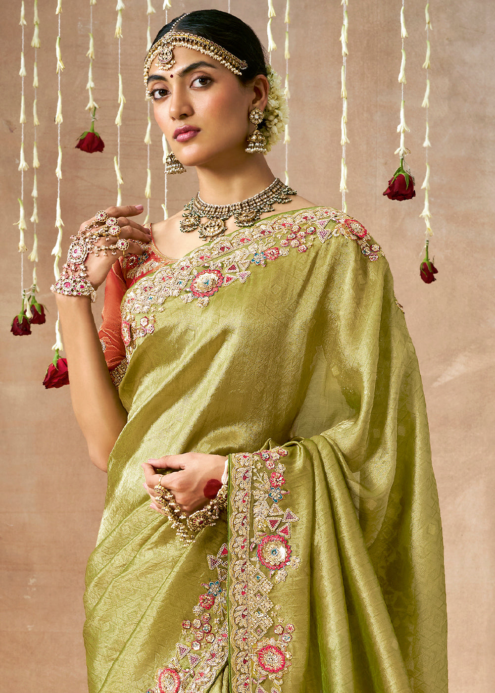 Pistachio Green Zari Woven Tissue Dola Silk Saree having Sequence, Pearl, Mirror & Thread Work: Festival Edition