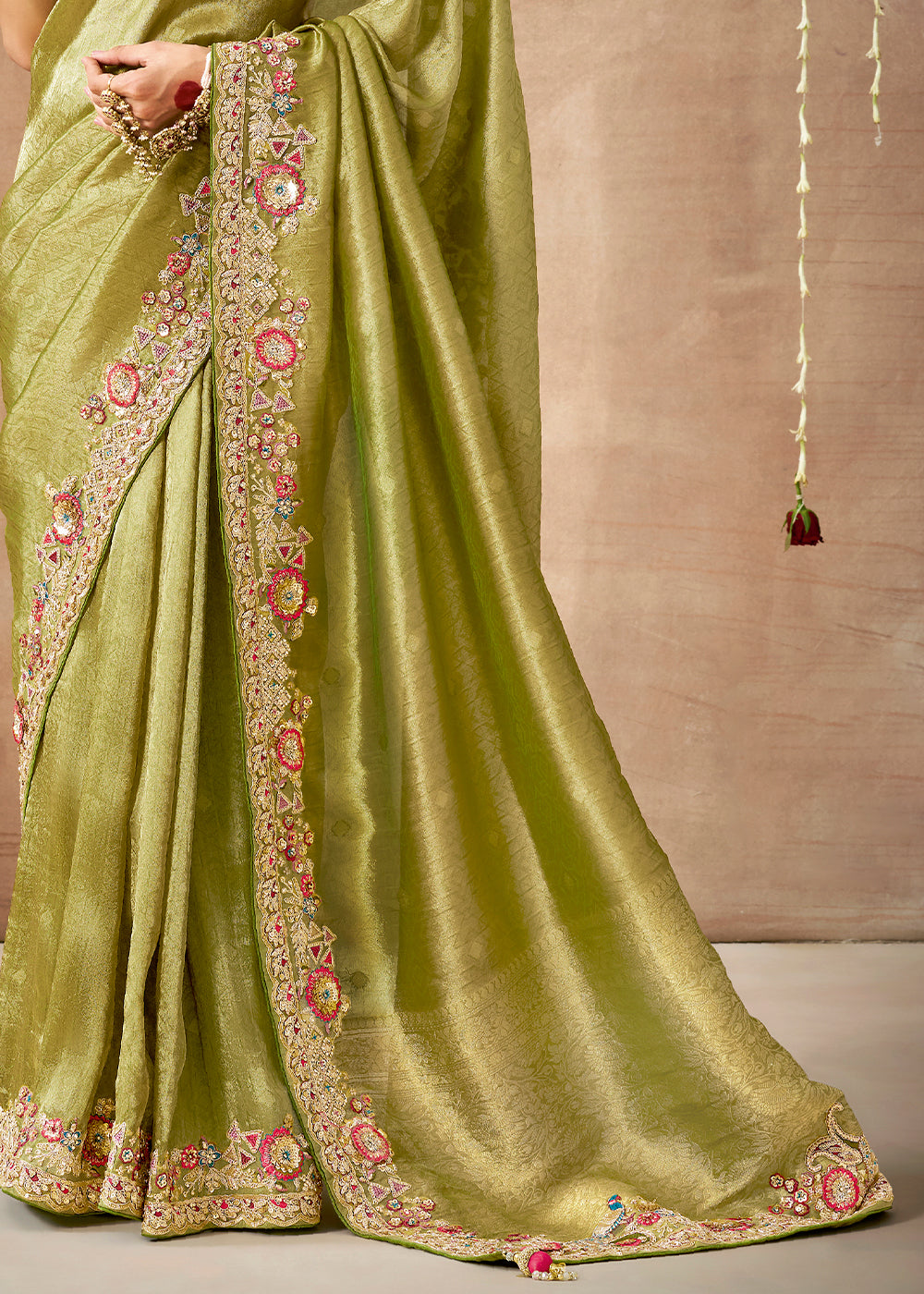 Pistachio Green Zari Woven Tissue Dola Silk Saree having Sequence, Pearl, Mirror & Thread Work: Festival Edition