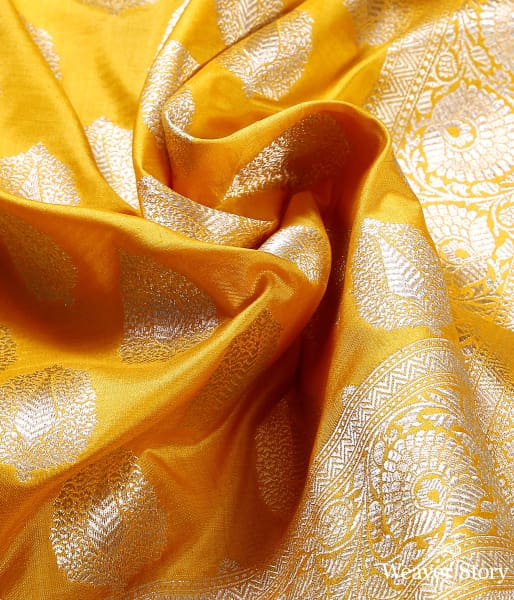 Yellow katan silk dupatta with leaf motifs and floral border