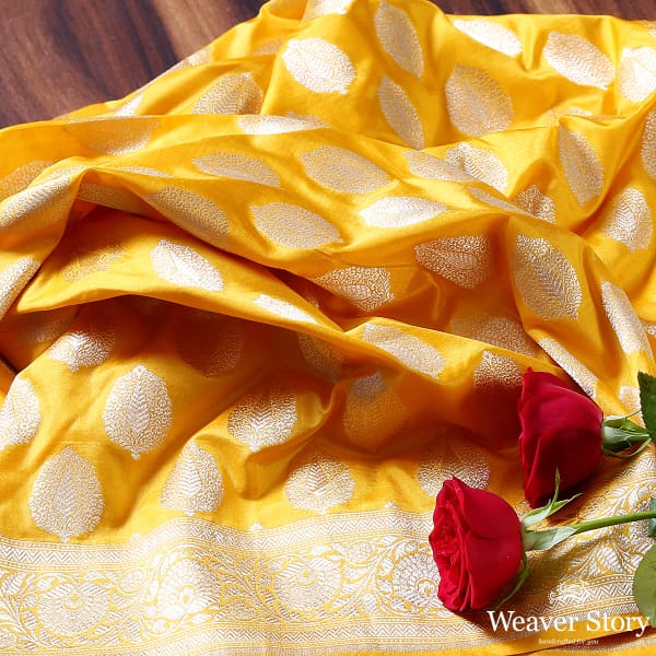 Yellow katan silk dupatta with leaf motifs and floral border