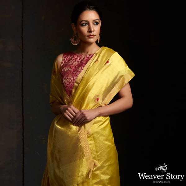 Lime green chanderi silk saree with floral bootis in gold zari with meenakari.