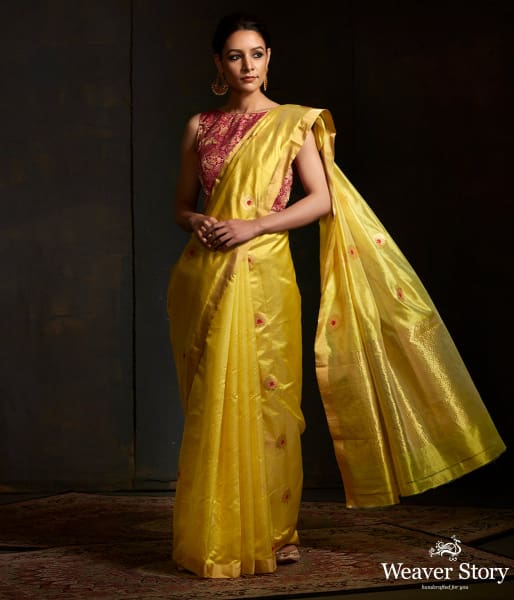 Lime green chanderi silk saree with floral bootis in gold zari with meenakari.