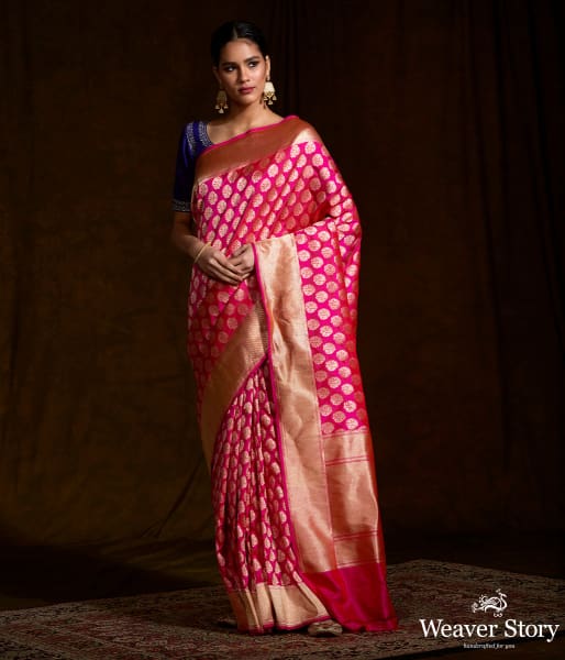 Handwoven pink katan silk saree with floral motifs and zari border