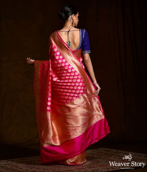 Handwoven pink katan silk saree with floral motifs and zari border