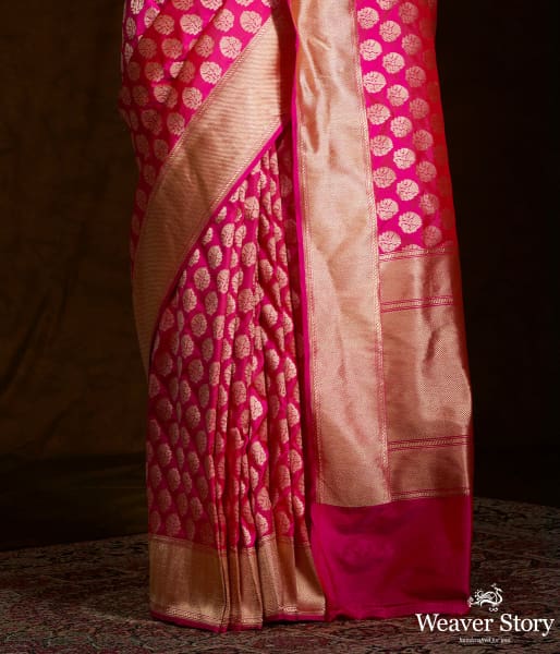 Handwoven pink katan silk saree with floral motifs and zari border