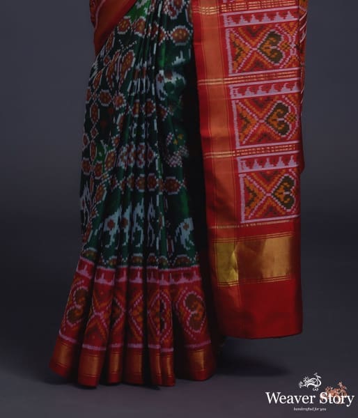 Pure silk Gujarat Patola saree in emerald green and red with horse, swan and fish motifs