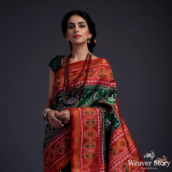 Pure silk Gujarat Patola saree in emerald green and red with horse, swan and fish motifs