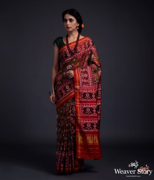 Pure silk Gujarat Patola saree in Green and red dual  and animal motifs woven diagonally