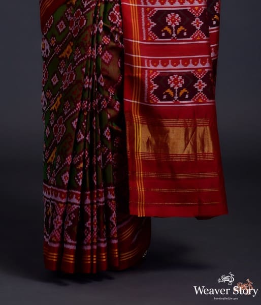 Pure silk Gujarat Patola saree in Green and red dual  and animal motifs woven diagonally