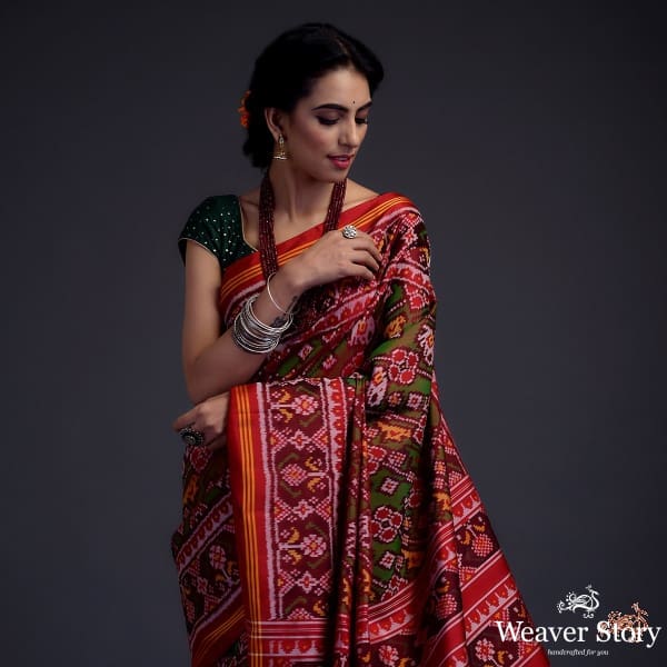 Pure silk Gujarat Patola saree in Green and red dual  and animal motifs woven diagonally