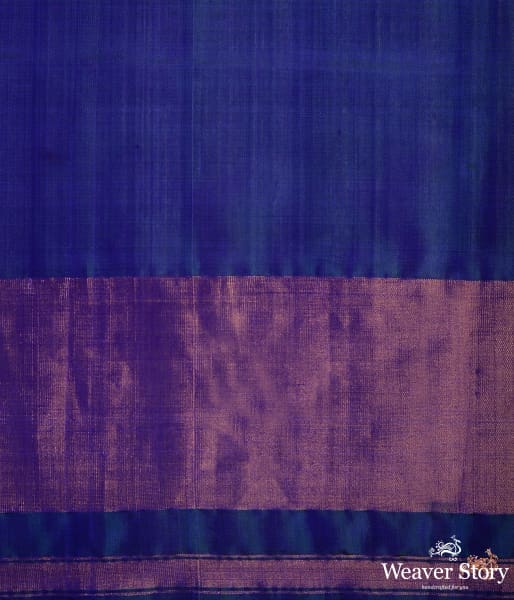 Blue dual tone single ikat patola saree with a purple and gold tissue border