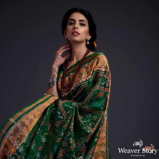 Emerald green single ikat patola saree with tissue border