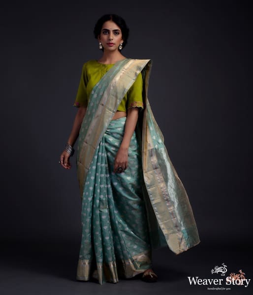 Green chanderi silk saree with floral motifs and a tissue weft