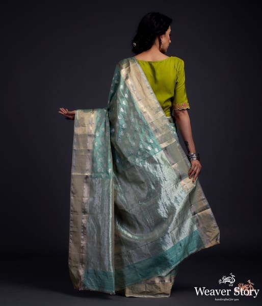 Green chanderi silk saree with floral motifs and a tissue weft