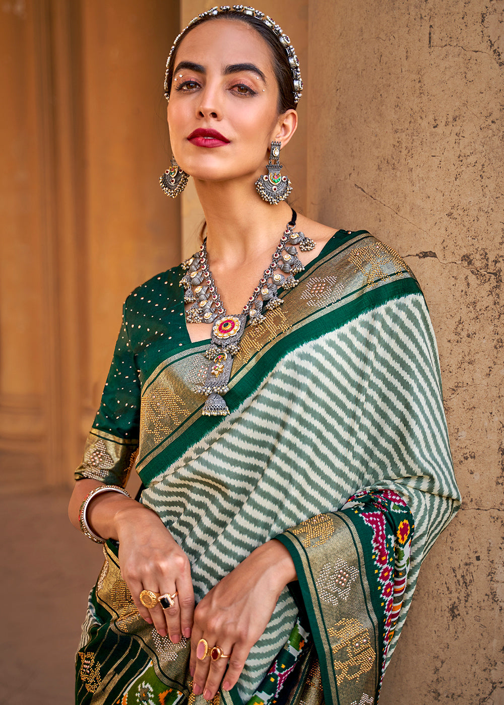 Dark Green Designer Patola Silk Saree with Zari Border & Stone work(Pre-Order)