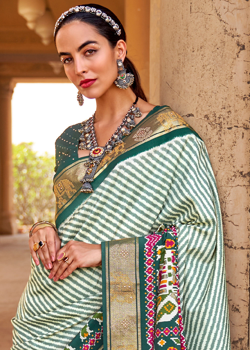 Dark Green Designer Patola Silk Saree with Zari Border & Stone work(Pre-Order)