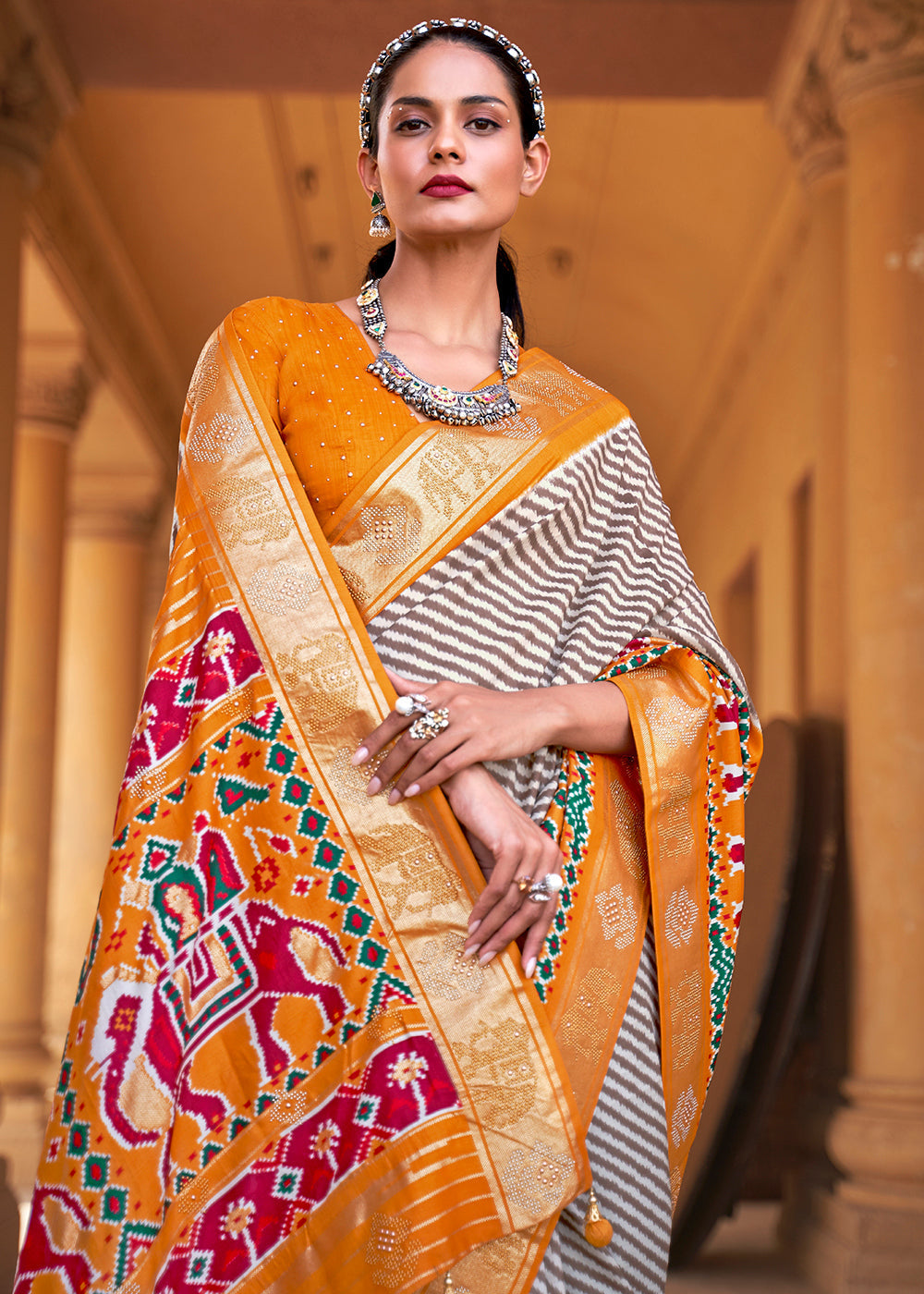 Chrome Yellow Designer Patola Silk Saree with Zari Border & Stone work