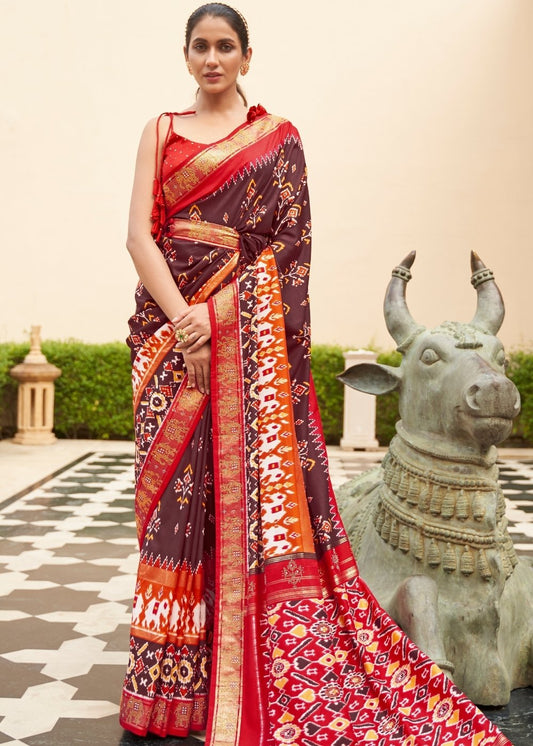 Brown & Red Patola Silk Saree with Zari Border & Tassels On Pallu