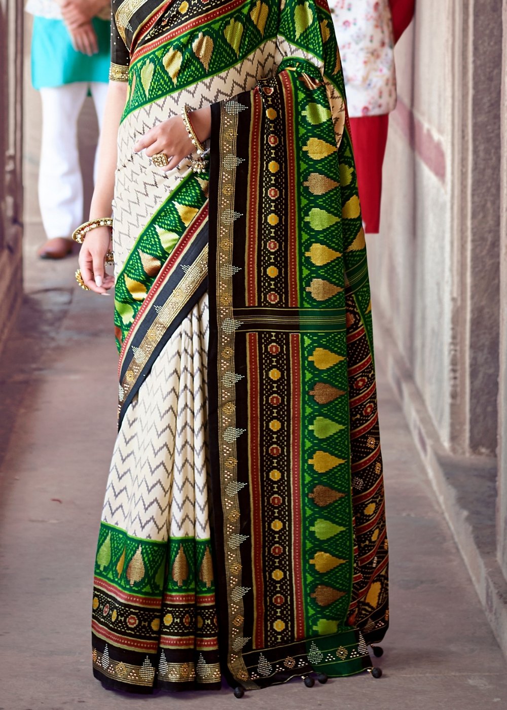 Daisy White & Green Patola Silk Saree with Zari Border Pallu & Stone work