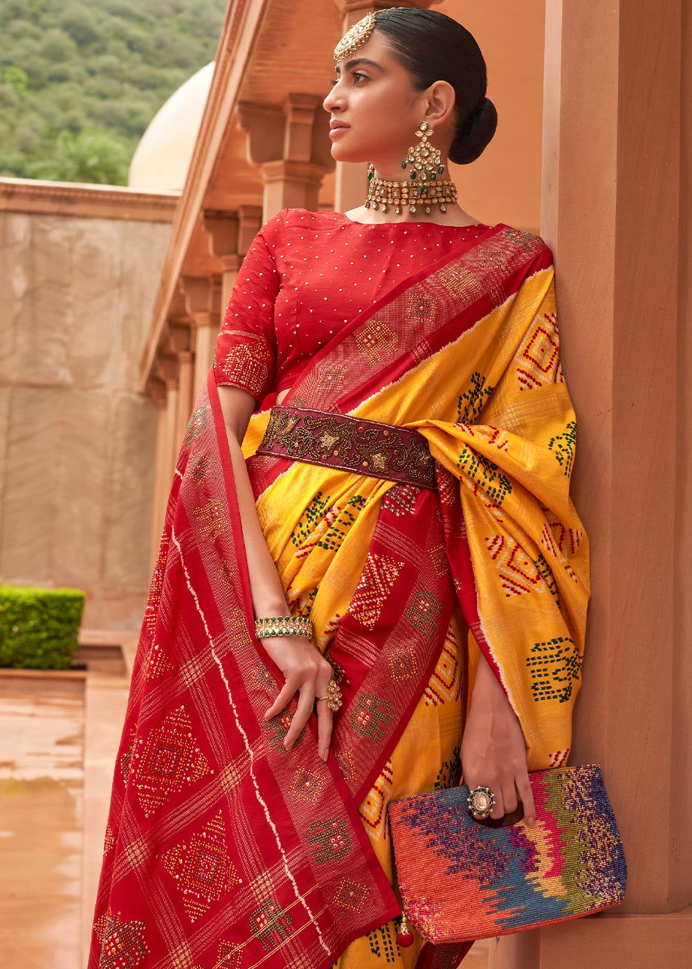 Saffron Yellow Printed Patola Silk Saree with Swaroski Work