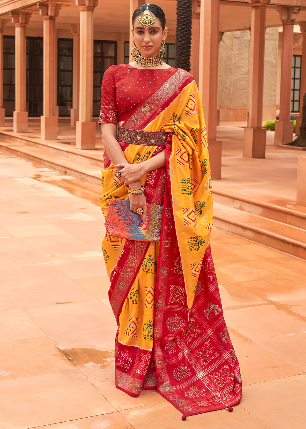 Saffron Yellow Printed Patola Silk Saree with Swaroski Work